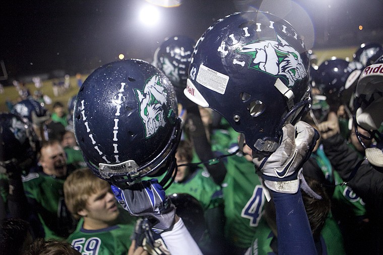 &lt;p&gt;The Wolfpack hold up their helmets after Glacier's playoff
victory over Billings Senior Friday night at Legends Stadium.&lt;/p&gt;