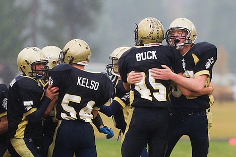 &lt;p&gt;Timberlake High's Dalton Jones, far right, reacts while hugging Daniel Buck Saturday during a team celebration after winning the 3A Region 1 Championship in Spirit Lake against Weiser High School.&lt;/p&gt;