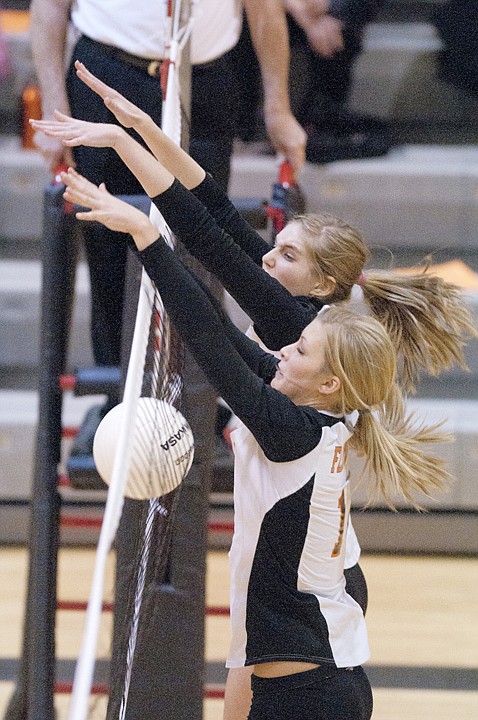 &lt;p&gt;Flathead sophomore Timi Severson, front, and junior Kwyn Johnson
make a block during Flathead's play-in win over Missoula Big Sky
Thursday night at Flathead High School.&lt;/p&gt;