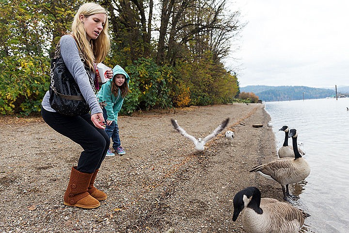 &lt;p&gt;SHAWN GUST/Press&lt;/p&gt;&lt;p&gt;Crystal White and her daughter Anika, 10, of Hayden, feed Canada geese some scraps of her lunch Thursday along the bank of the Spokane River in Coeur d&#146;Alene.&lt;/p&gt;