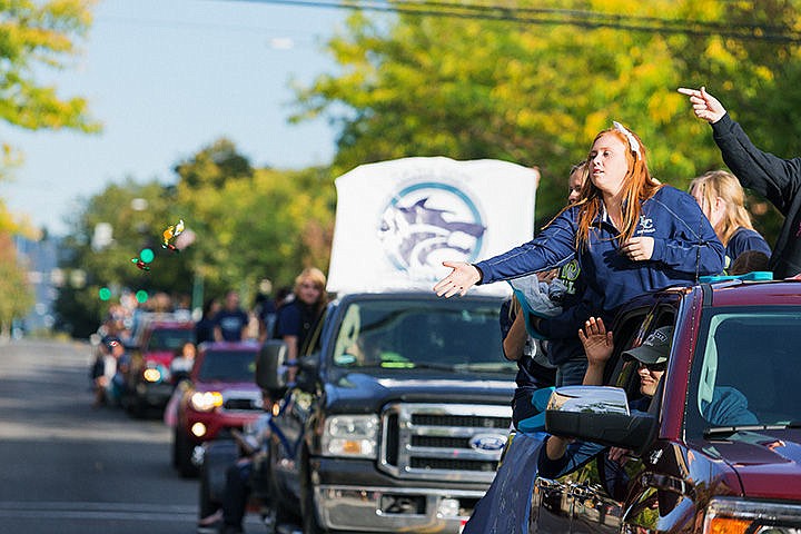 &lt;p&gt;SHAWN GUST/Press&lt;/p&gt;&lt;p&gt;Michaela Flerchinger, a junior on the Lake City High softball team, tosses candy to the crowd during the school&#146;s homecoming parade Friday on Sherman Avenue in Coeur d&#146;Alene.&lt;/p&gt;