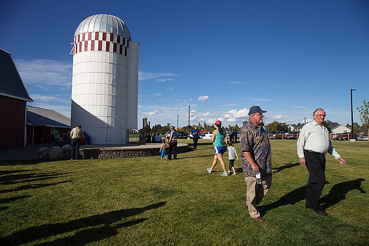 &lt;p&gt;TESS FREEMAN/Press&lt;/p&gt;&lt;p&gt;Attendees of the Stoddard Park opening ceremony walk through the newly completed park in Hayden on Tuesday afternoon. The city of Hayden purchased the property in 2005 and the city spent $800,000 from impact fees on the project.&lt;/p&gt;