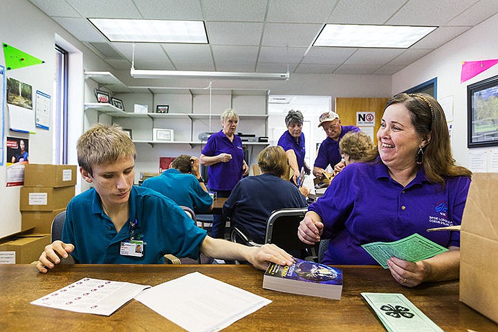 &lt;p&gt;SHAWN GUST/Press&lt;/p&gt;&lt;p&gt;After attaching a label, Chris Leighton, a student with Project SEARCH, left, hands a dictionary to Coeur d&#146;Alene Elks Lodge #1254 member Pam Alexander Tuesday as volunteers prepare 842 dictionaries for delivery to third grade students in the Coeur d&#146;Alene School District. The program, in its 12th year, combines a national Elks Club grant with member donations to purchase the reference materials for distribution.&lt;/p&gt;