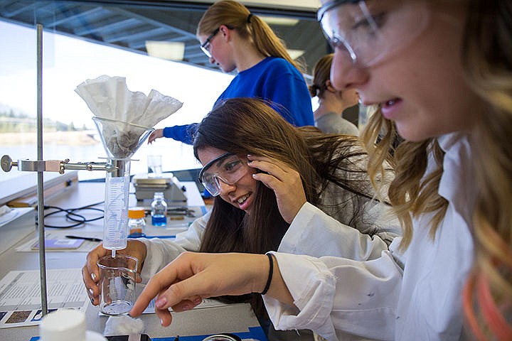 &lt;p&gt;TESS FREEMAN/Press&lt;/p&gt;&lt;p&gt;Coeur d&#146;Alene High School sophomores Carleigh Waites, right, Kaysha Padilla, center, and Ali Williams work as a team to make a filtration system at the Women in Science event at University of Idaho on Tuesday afternoon. The University of Idaho hosted over 150 girls from Coeur d&#146;Alene High School, Lake City High School and Coeur d&#146;Alene Charter Academy to teach them about careers in the field of science.&lt;/p&gt;