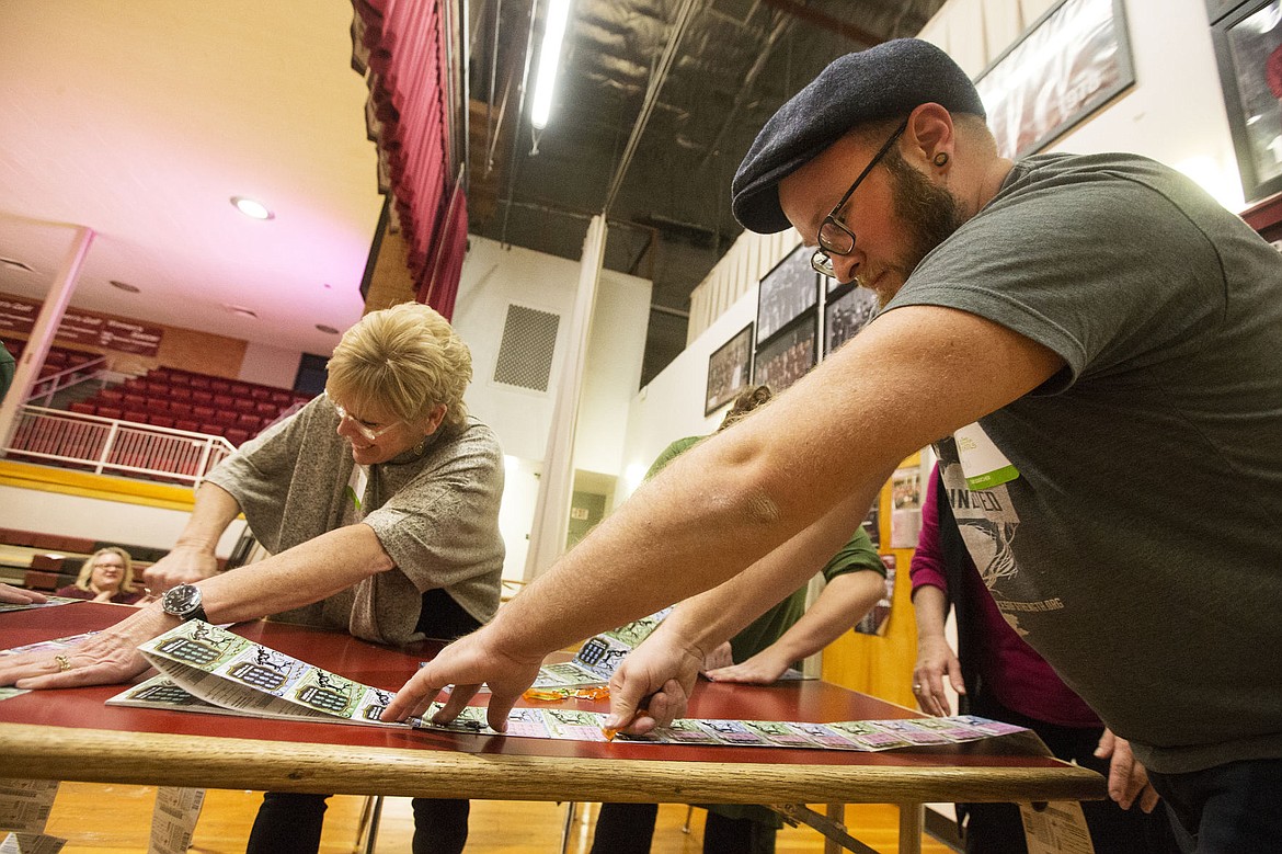 &lt;p&gt;Joel Holmes, right, an art teacher at Priest River High School and Kristi Payne, left, from St. Maries Community Education Center scratch as many lottery tickets as they can in a minute during the final round of Idaho Lottery's Scratch For Schools Event at North Idaho College Wednesday night. Priest River beat out St. Maries Community Education Center, winning $541 from its tickets.&lt;/p&gt;