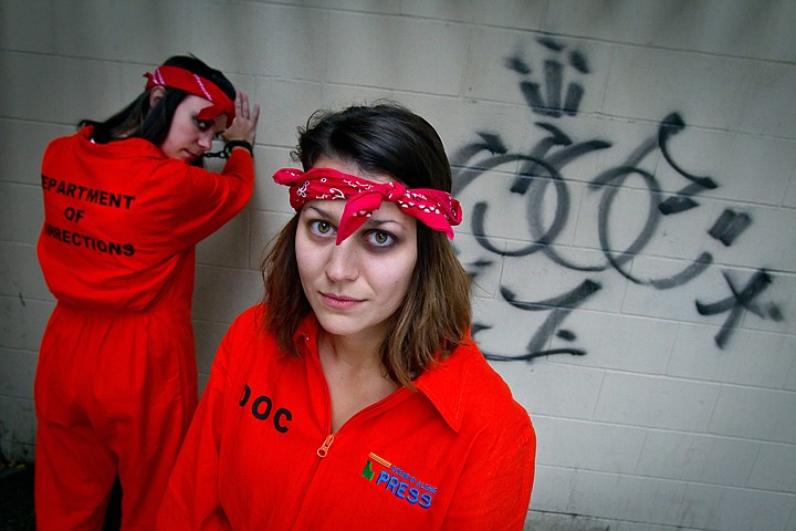 &lt;p&gt;JEROME A. POLLOS/Press Nicole Choquette, right, an outside sales assistant at the Coeur d'Alene Press, and Emily Williams, a graphic designer at the Press, were in the Halloween spirit when they donned their &quot;Department of Corrections&quot; jumpsuits for work Friday.&lt;/p&gt;