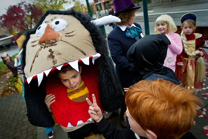 &lt;p&gt;JEROME A. POLLOS/Press Caid Wood, 9, walks along Sherman Avenue in his &quot;Wild Thing&quot; costume while listening to his classmate talk about how much candy he received during Sorensen Magnet School's Halloween parade Friday.&lt;/p&gt;