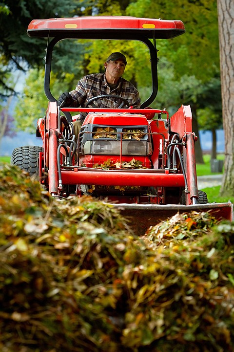 &lt;p&gt;JEROME A. POLLOS/Press Sam Lapresta, with the City of Coeur d'Alene Parks Department, pushes a pile of leaves with a tractor Tuesday as crews begin their leaf collection efforts in City Park.&lt;/p&gt;