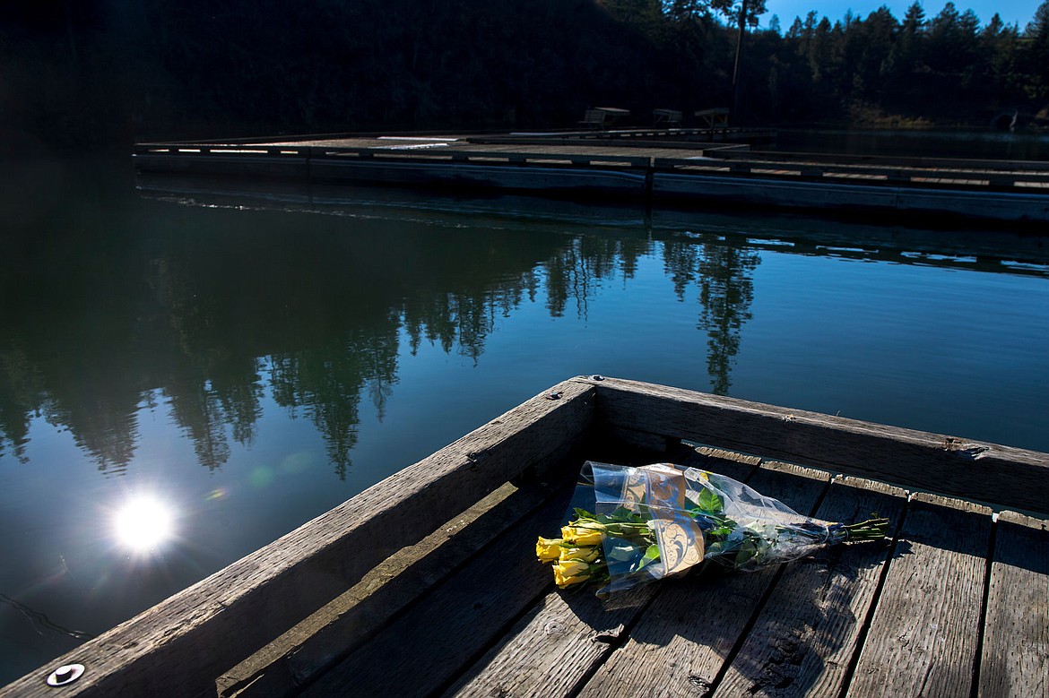 &lt;p&gt;A bouquet of yellow roses rest on the Fernan Lake boat launch on Friday. The bodies of Tristan Phelps, 1, Riley Phelps, 2, and Misty Phelps, 25, were found Thursday morning inside a fully submerged sedan at the boat launch.&lt;/p&gt;