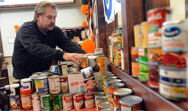 &lt;p&gt;Matt Alexander, warehouse manager for the Flathead Food Bank, boxes up food donations from Glacier High School Friday at U.S. Bank in Kalispell. Glacier and Flathead high schools held a crosstown competition to see who could collect the most donations for the food bank. Flathead High School won the challenge by bringing in 1,063 pounds of food and $976. Glacier donations totaled 981 pounds and $360. For each dollar donation, the schools were credited for one pound, bringing the final total to 2,039 pounds for Flathead to 1,341 for Glacier. The results of the crosstown food drive were announced Friday night at the crosstown football game. The winning school receives $200 for its booster club plus a commemorative football autographed by the Denver Broncos. The football was donated by Broncos quarterback Brock Osweiler, a Flathead graduate.&lt;/p&gt;