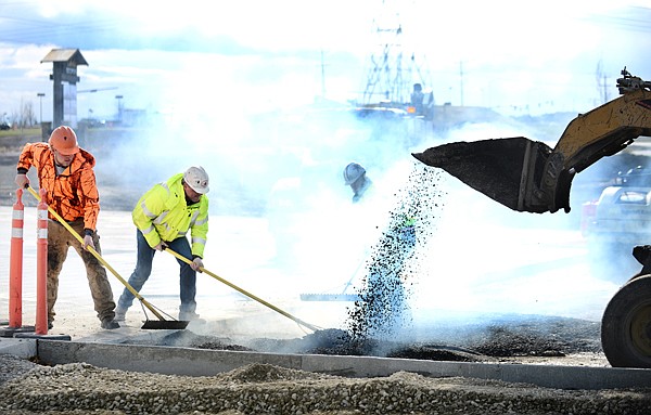 &lt;p&gt;Workers begin paving the bypass near the intersection of U.S. 93 and West Reserve on Monday in Kalispell. (Brenda Ahearn/Daily Inter Lake)&lt;/p&gt;