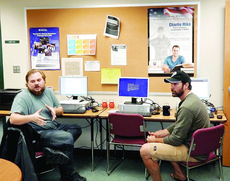 &lt;p&gt;Matthew Austin, left, describes a class assignment to fellow veterans Mike Steppe, right, and Amber Granzow (not pictured) in the new veterans center at Flathead Valley Community College.&lt;/p&gt;