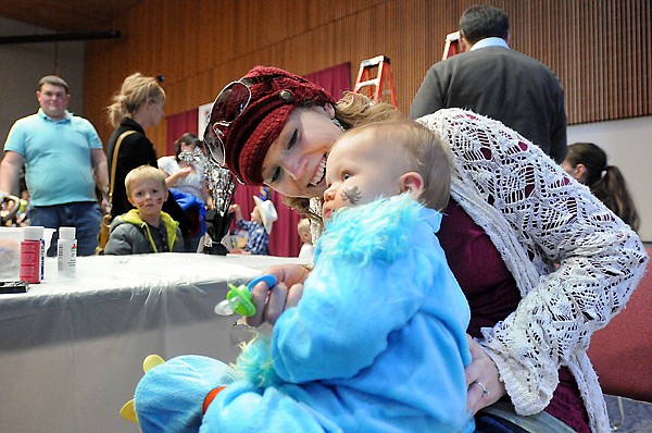 &lt;p&gt;Aleysha Wagner of Kalsipell smiles at her son Easton, 11 months, after he nervously gets a spider painted on his face at the Flathead Valley Community College Halloween Party on Tuesday, October 29, in Kalispell. (Brenda Ahearn/Daily Inter Lake)&lt;/p&gt;