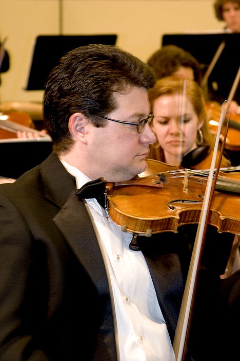 <p>Coeur d'Alene Symphony's Phil Baldwin performs during a show.</p>