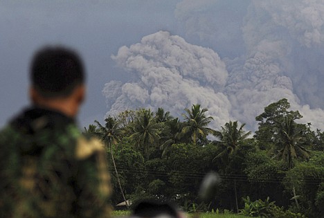 &lt;p&gt;An Indonesian soldier watches volcanic materials released by Mount Merapi as it erupts in Sidorejo, Central Java, Indonesia, Wednesday, Nov. 3, 2010. Indonesia's deadly volcano erupted Wednesday with its biggest blast yet, shooting searing ash miles into the sky and forcing the hasty evacuations of panicked villagers and emergency shelters near the base.&lt;/p&gt;