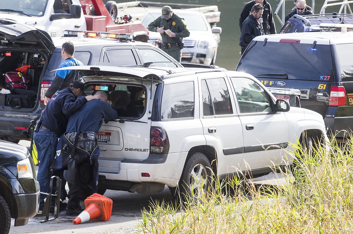 &lt;p&gt;A Coeur d'Alene Fire responder comforts a diver after the dive team responded to a submerged passenger car fatality on Thursday at the Fernan Lake boat launch.&lt;/p&gt;