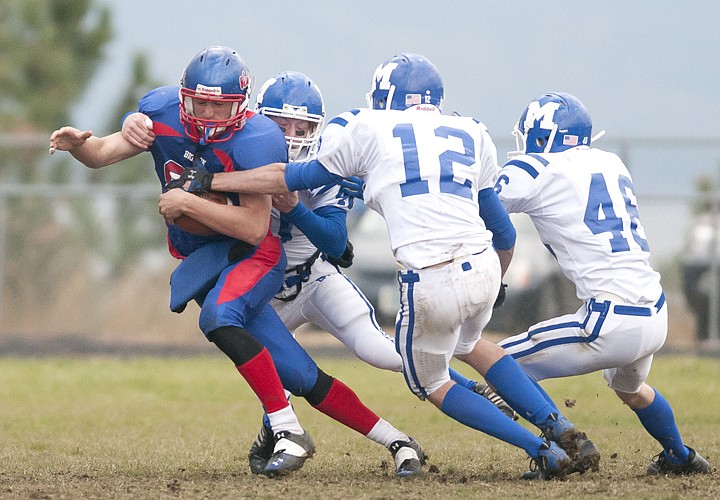 &lt;p&gt;Bigfork wide receiver Ian Lorang tries to escape the tackle of
several Malta defenders.&lt;/p&gt;