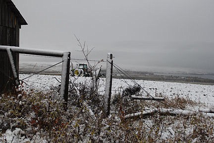 &lt;p&gt;A Gothic view of an old outbuilding with a snow-covered tractor behind on a snowy field.&lt;/p&gt;