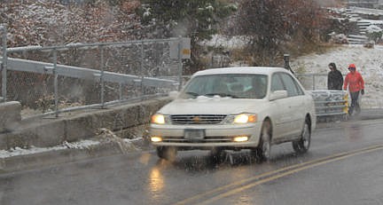 &lt;p&gt;A couple takes a walk through a drizzly snow Sunday morning.&lt;/p&gt;