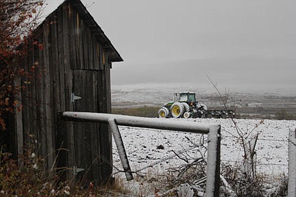 &lt;p&gt;A Gothic view of an old outbuilding with a snow-covered tractor behind on a snowy field.&lt;/p&gt;