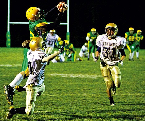 &lt;p&gt;Lakeland High's Brett Webb leaps in front of Michael Carr from Middleton High to make a reception as Hyder Jessup closes in to make the hit Friday in the Hawk's 42-20 loss in the state 4A quarterfinals in Rathdrum.&lt;/p&gt;