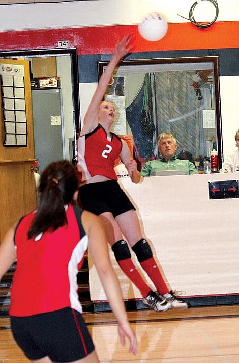 Jamie Doran/Valley Press MacKenzie Wood leaps up to smack the ball Friday night.