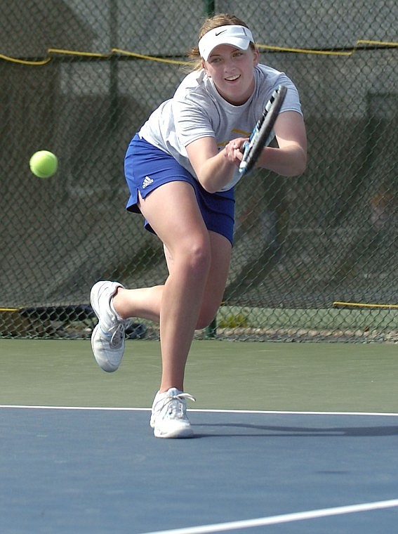 Jackie Mee keeps an eye on the ball during the Class A divisional tennis tournament in Kalispell last spring. Mee went on the win the state singles title.