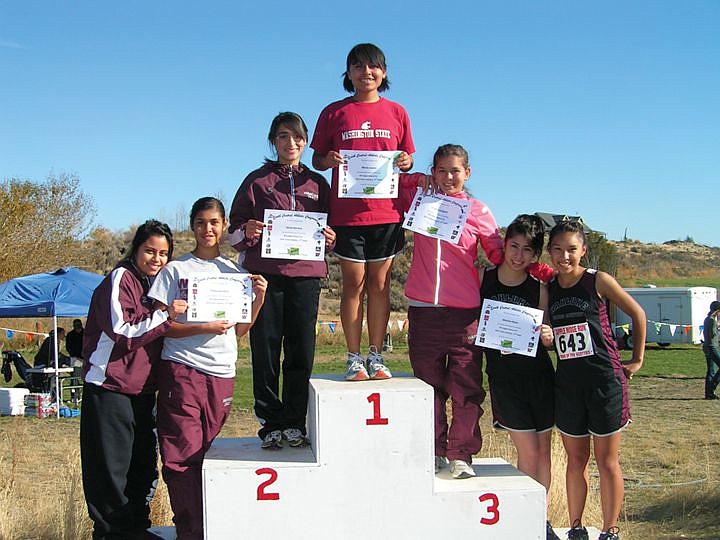 Left to right, Celeste Cruz, Thalia Quintero, Silvia Herrera,
Maria Juarez, Linda Achelpohl, Mariela Nava and Cristal Reyes make
up the Wahluke girls team that will compete at the state cross
country meet this Saturday.