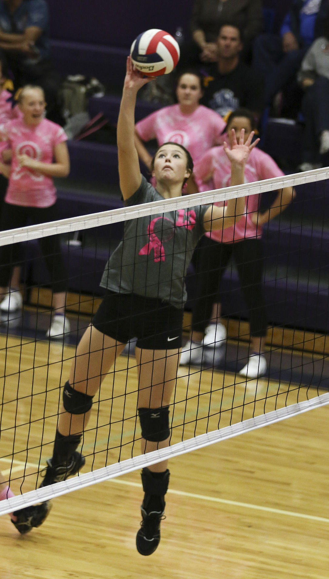 &lt;p&gt;Polson's Haley Fyant tips the ball over the net during their game against Columbia Fals on Thursday.&lt;/p&gt;