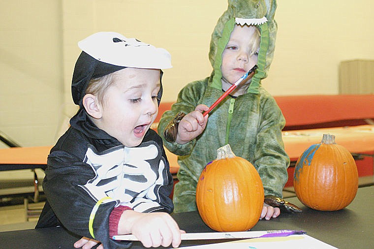 &lt;p&gt;Aiden Skellenger, 3, and Trac Henkel, 2, work on painting pumpkins at Hot Springs' Family Fun Night.&lt;/p&gt;