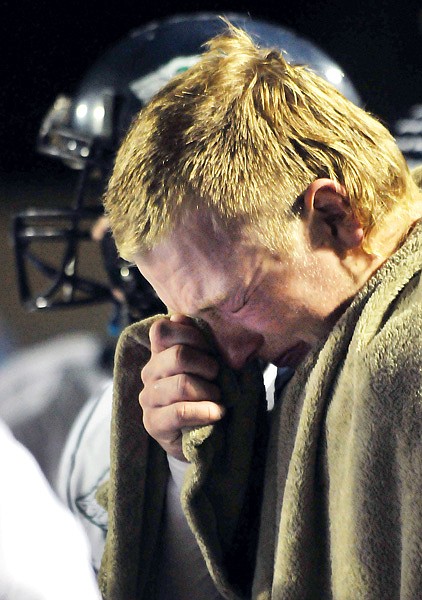 Glacier High's Collter Hanson becomes emotional on the sideline during the first half of Friday's evening's AA playoff game against Helena High. Hanson suffered a concussion in the first half, forcing the Wolfpack to use their backup quarterbacks in the game.