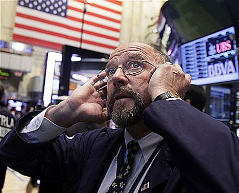 &lt;p&gt;In this Sept. 20 photo, trader Frederick Reimer works on the floor of the New York Stock Exchange.&lt;/p&gt;