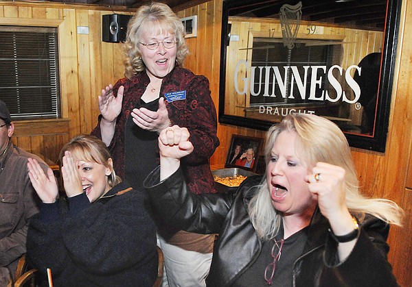 Pam Holmquist, center, celebrates with Kalispell Mayor Tammi Fisher, left, and campaign chairwoman Mickey Lapp as results from the absentee ballots come in with Holmquist firmly in the lead. Holmquist handily won election as Flathead County commissioner.