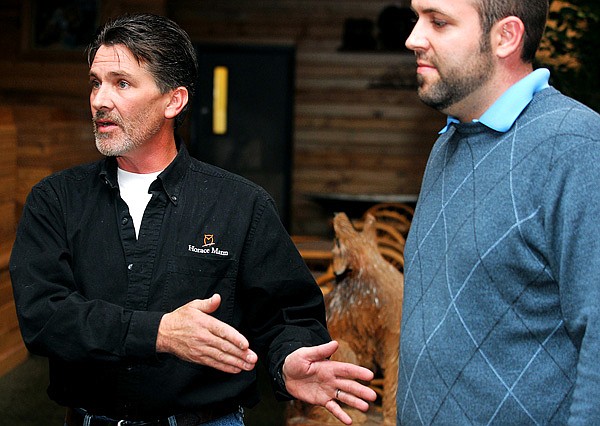 Mark Appleby, left, talks about Raymond Pitman (right) and his encounter with a pack of wolves after they were trying to pack out an elk they shot in the South Fork River Drainage last week.