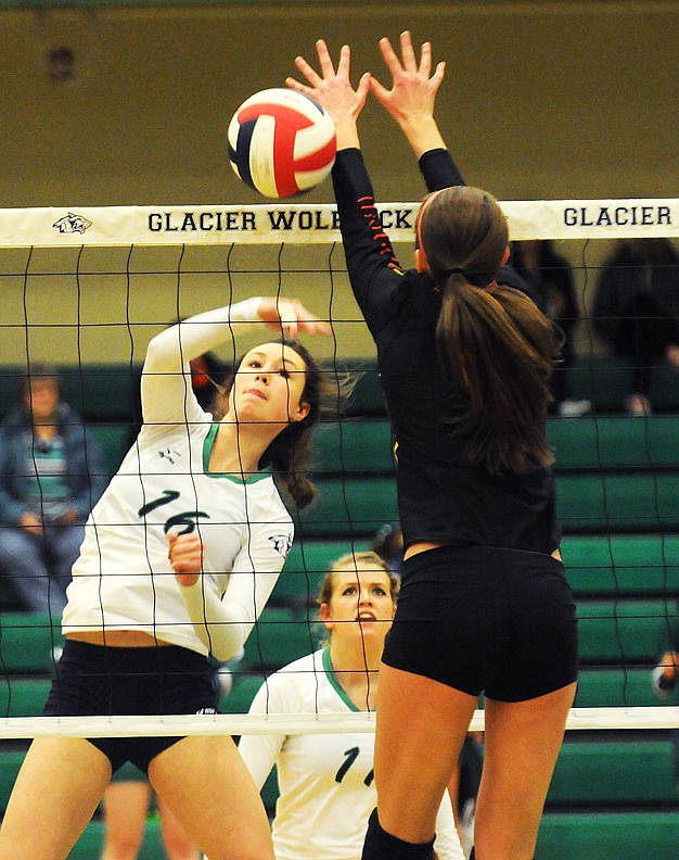 &lt;p&gt;Glacier's Abigail Fiske knocks the ball past Missoula Hellgate's Kaci Paffhausen at Glacier on Thursday. (Aaric Bryan/Daily Inter Lake)&lt;/p&gt;