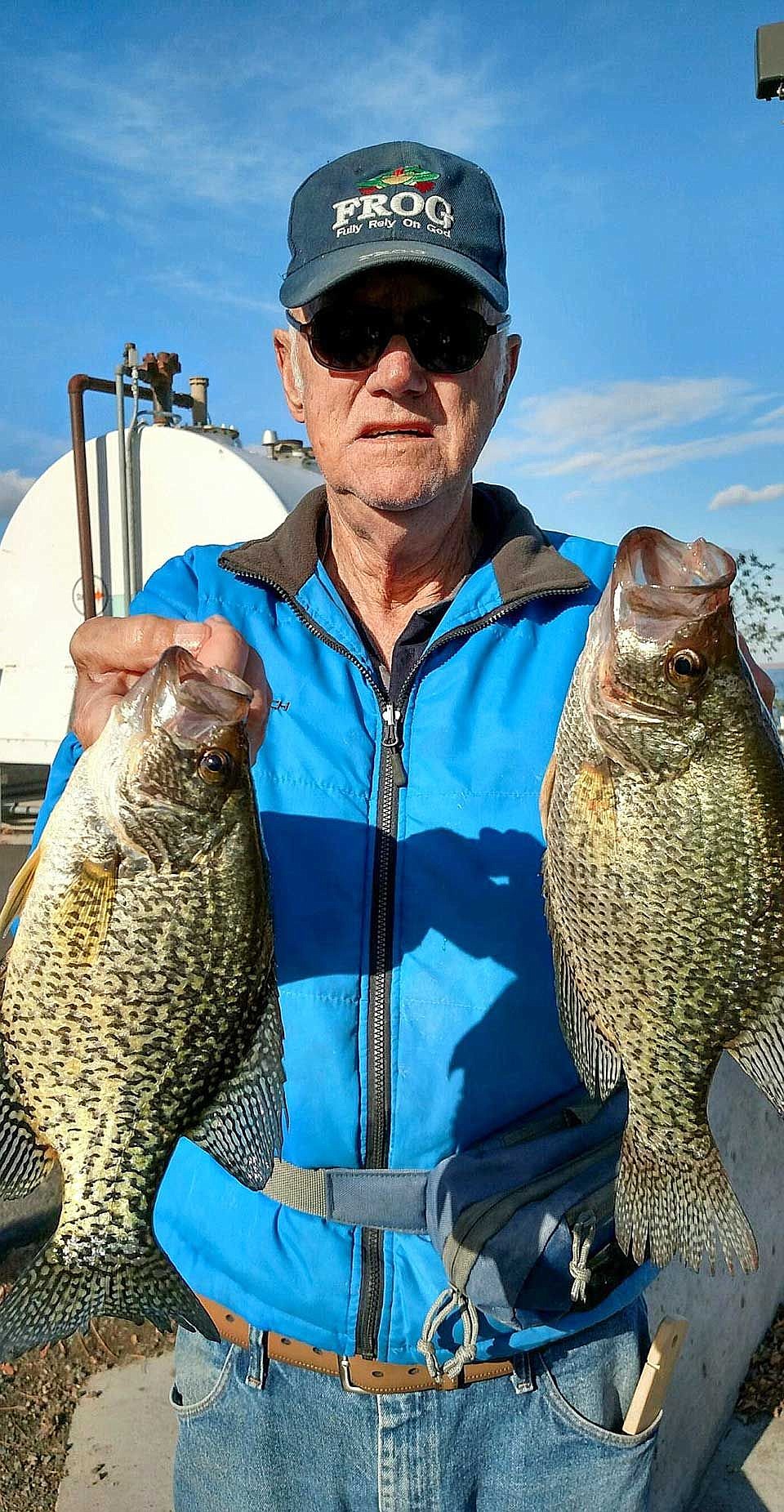 Robert of Moses Lake shows two of his fourteen jumbo crappie caught off the MarDon dock.