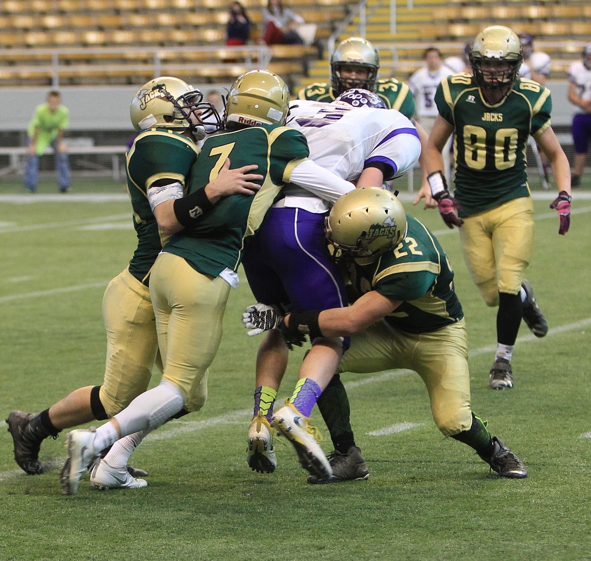 &lt;p&gt;JASON ELLIOTT/Press&lt;/p&gt;&lt;p&gt;North Fremont receiver Blake Oberhansley is tackled by a host of St. Maries defenders including Dakota Wilson (22), Jake Sieler (7) and Caden Hall (44) during the second quarter of Saturday's state 2A football quarterfinal game at the Kibbie Dome in Moscow.&lt;/p&gt;