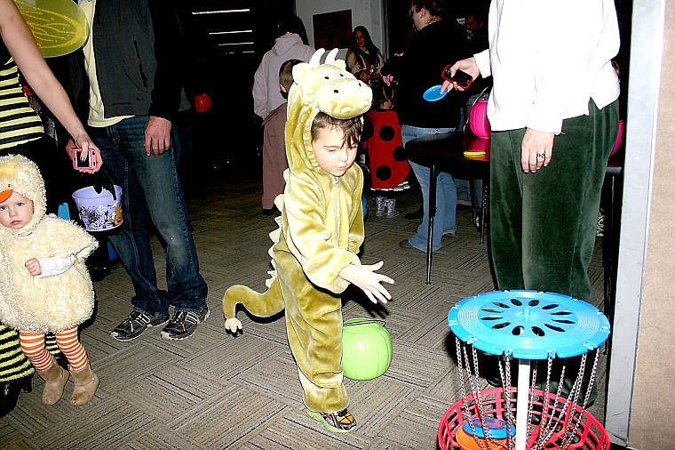 &lt;p&gt;Austin Hotchkiss tries to toss a Frisbee&reg; into the basket during a game at St. Regis Public School's Halloween Carnival. The night included other games, a haunted house and a trunk or treat event later in the evening.&lt;/p&gt;