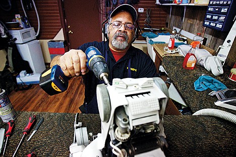 &lt;p&gt;Tom Rutley assembles a Kirby vacuum cleaner after performing a cleaning and maintenance check Wednesday at the local storefront for Kirby he began working for in the early 1990s.&lt;/p&gt;