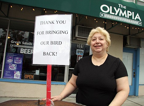 &lt;p&gt;Eva Itskos, co-owner of Olympia restaurant, stands outside her business Saturday, having replaced the sign that sought the return of a statue bird with a thank you note after the public art piece was returned late Friday night or early Saturday morning.&lt;/p&gt;