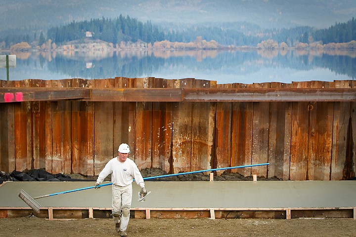 &lt;p&gt;Mitch Whetzel, with Mitch Whetzel Concrete, carries equipment up the grade of the Hauser Lake boat launch Friday after smoothing a freshly pour concrete slab.&lt;/p&gt;