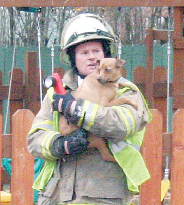 &lt;p&gt;Scott Beagle with house fire pup Nov. 4.&lt;/p&gt;