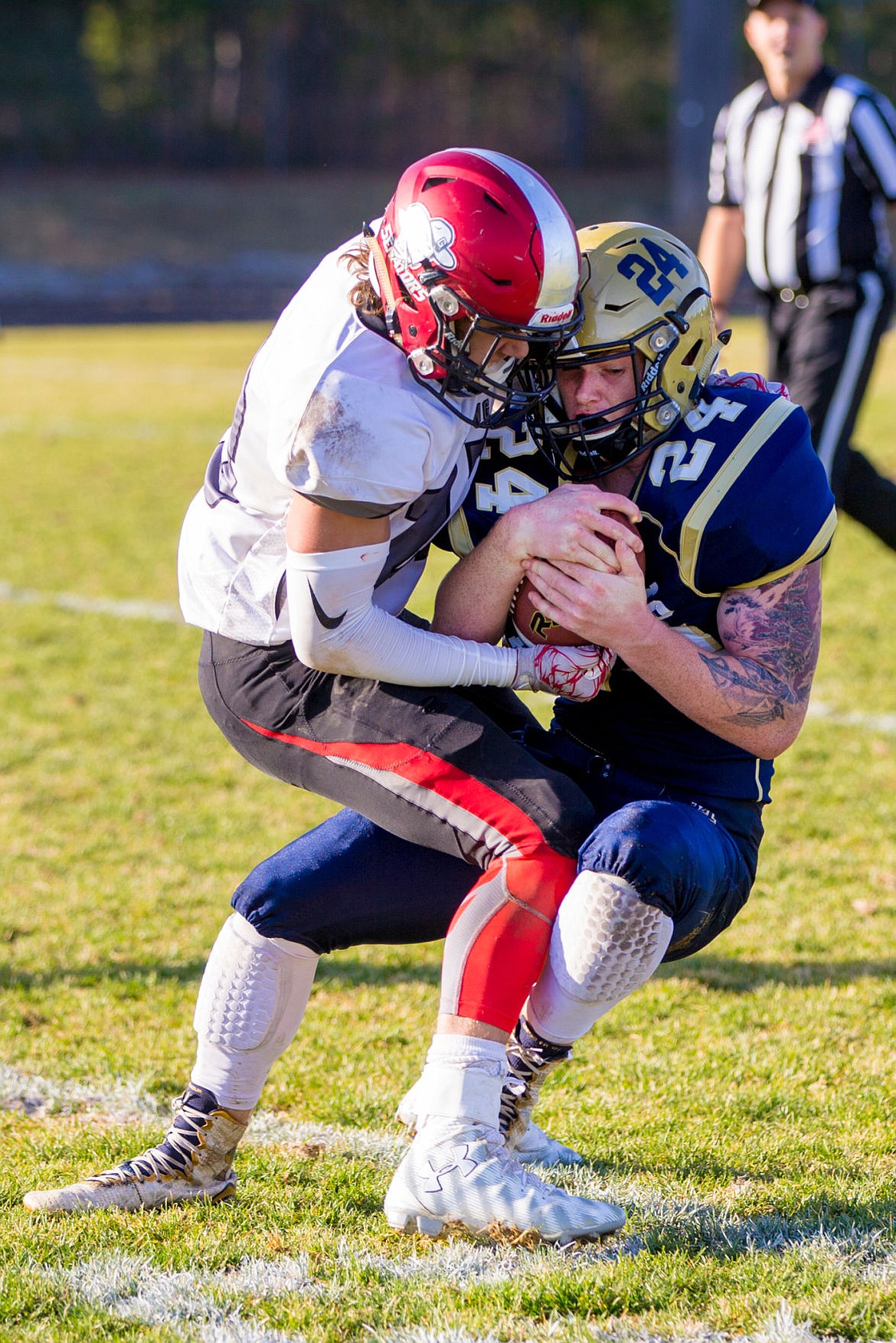 &lt;p&gt;JAKE PARRISH/Press Timberlake running back Ryan Stevens (24) is tackled by Cade Morris on Saturday at Timberlake High School.&lt;/p&gt;