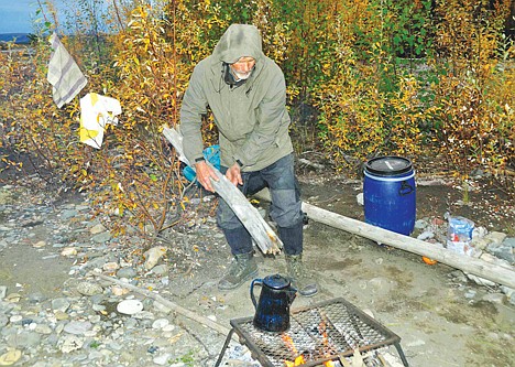 &lt;p&gt;Stuart Nelson works at the campsite in the Yukon where he spent 15 days waiting for rescue.&lt;/p&gt;