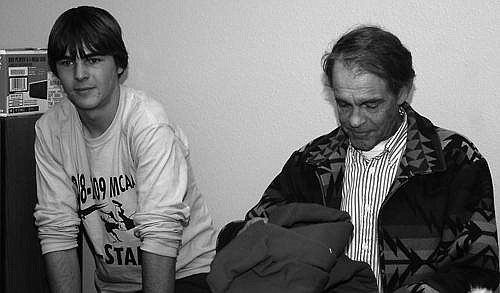 Mission Valley Christian Academy boys head coach Russ Lockhart, right, studies a sweatshirt and 
searches for the words to thank his boys for a great season. The gift was presented from the team by senior captain senior Josiah Murphy, left.