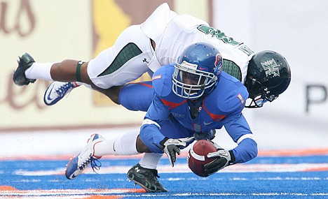 &lt;p&gt;Boise State wide receiver Titus Young (1) is tackled by Hawaii quarterback Corey Nielsen (8) in the first quarter during Saturday's game at Bronco Stadium in Boise.&lt;/p&gt;