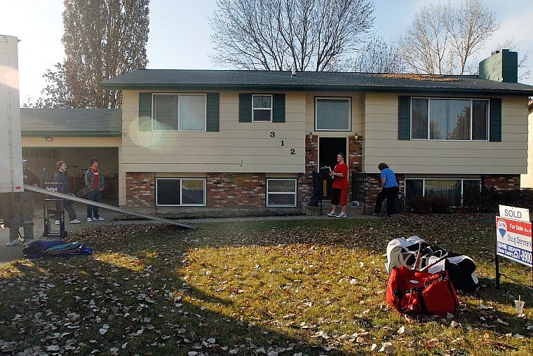 The Irvine family finishes packing up the remainder of their belongings from their home in west Kalispell, which sold for 18 percent less than what the house was appraised for in 2006.