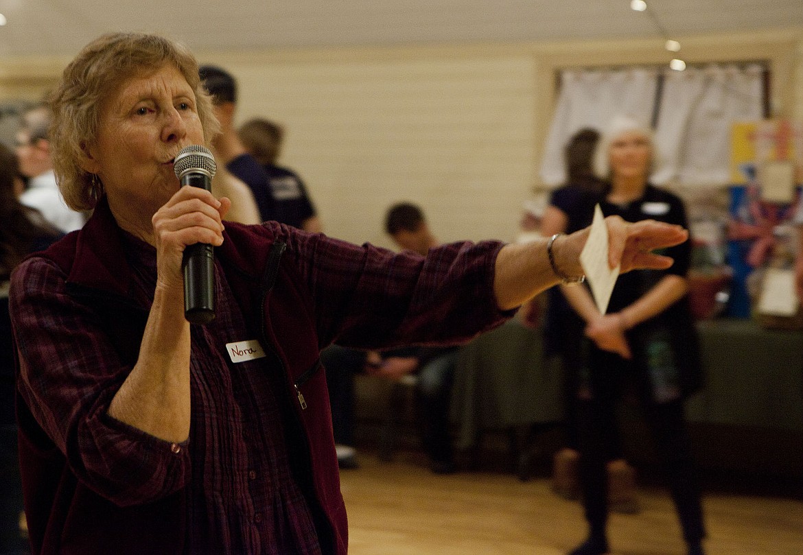 &lt;p&gt;KEITH COUSINS/Press&lt;/p&gt;&lt;p&gt;Nora Scott, from the Spokane area, instructs participants in a classic Contra dance during an event at the Meadowbrook Community Hall in Coeur d'Alene on Saturday.&lt;/p&gt;