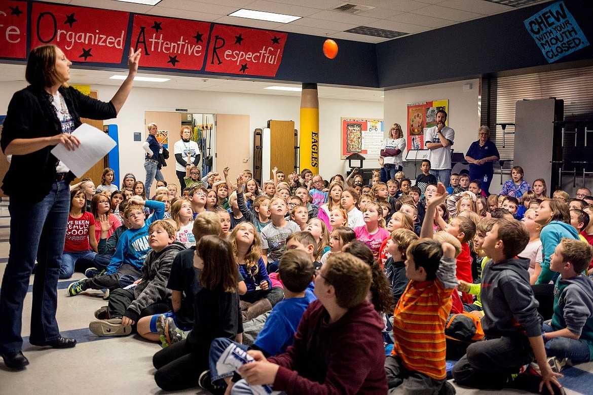 &lt;p&gt;A teacher throws a football into a crowd of Skyway Elementary School students on Friday as a reward for answering questions on how to prepare for Second Annual Think Through Math &quot;Mountain State Challenge&quot; against Utah Public Schools.&lt;/p&gt;