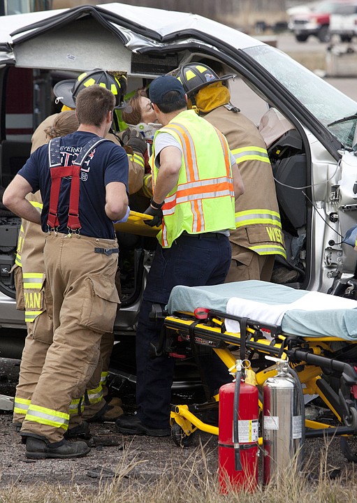 &lt;p&gt;Emergency crews work to free a woman from a Dodge Ram that was
involved in a head-on collision on U.S. 2 Friday afternoon.&lt;/p&gt;